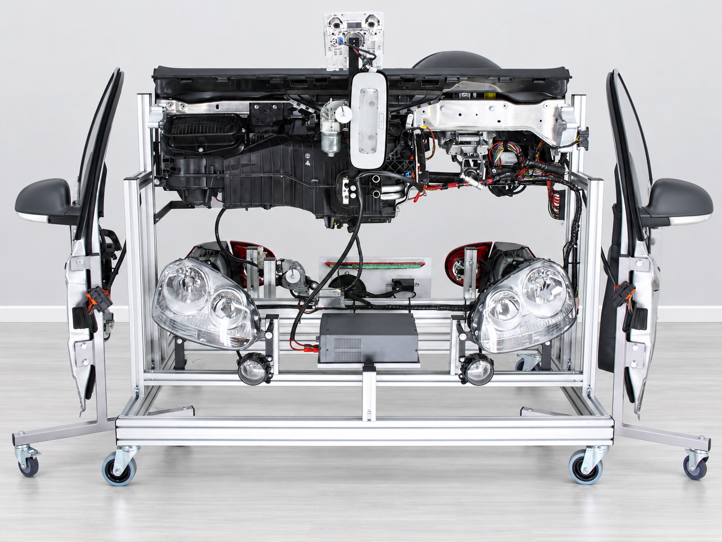 Rear view of the Golf V training model with headlights and vehicle components